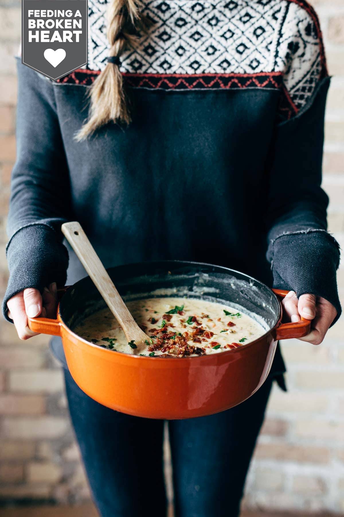 Woman holding a pot of Creamy Potato Soup