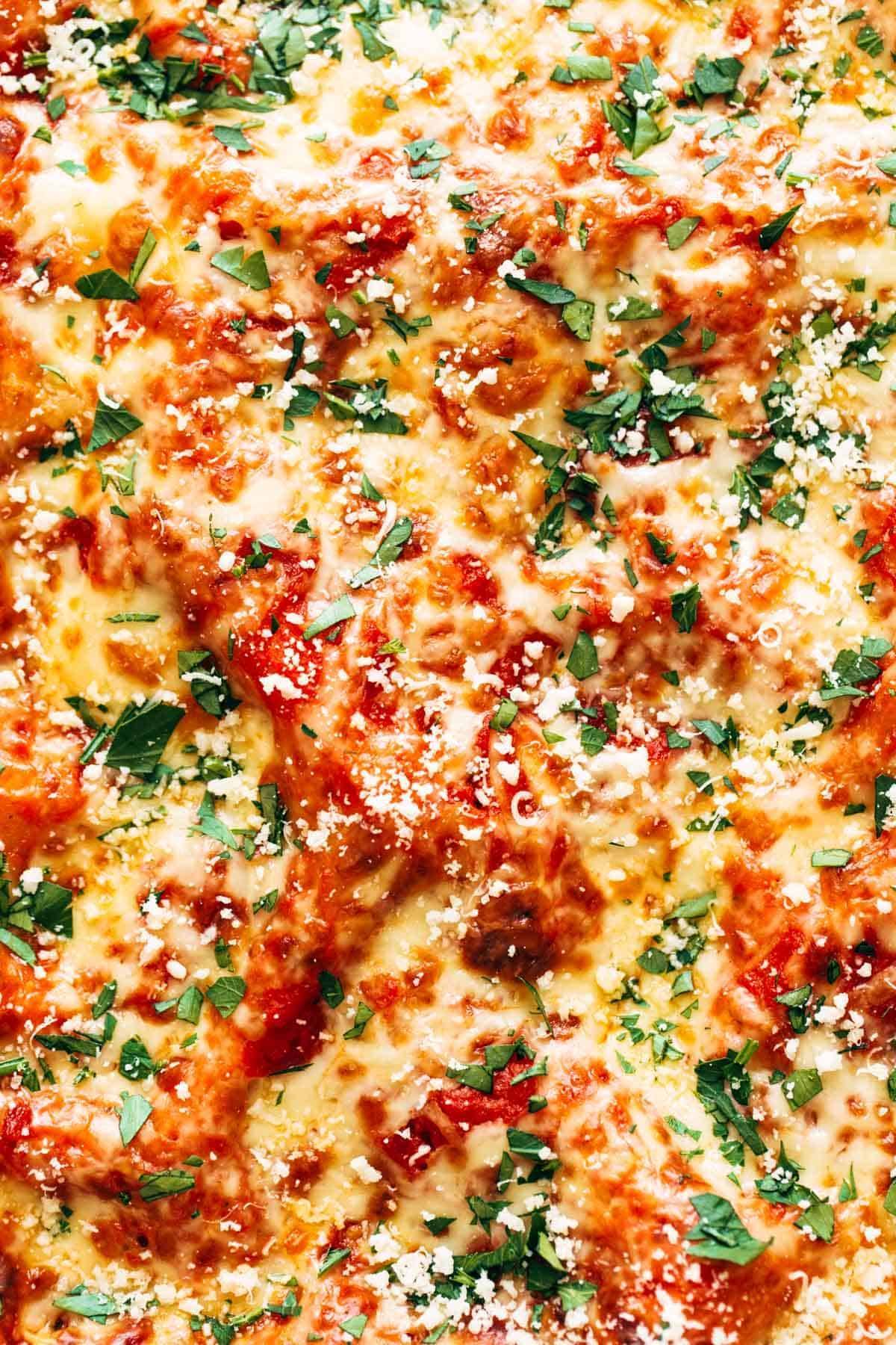 Close-up of lasagna florentine with cheese on top.