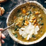 Detox Lentil Soup in a bowl with a spoon.