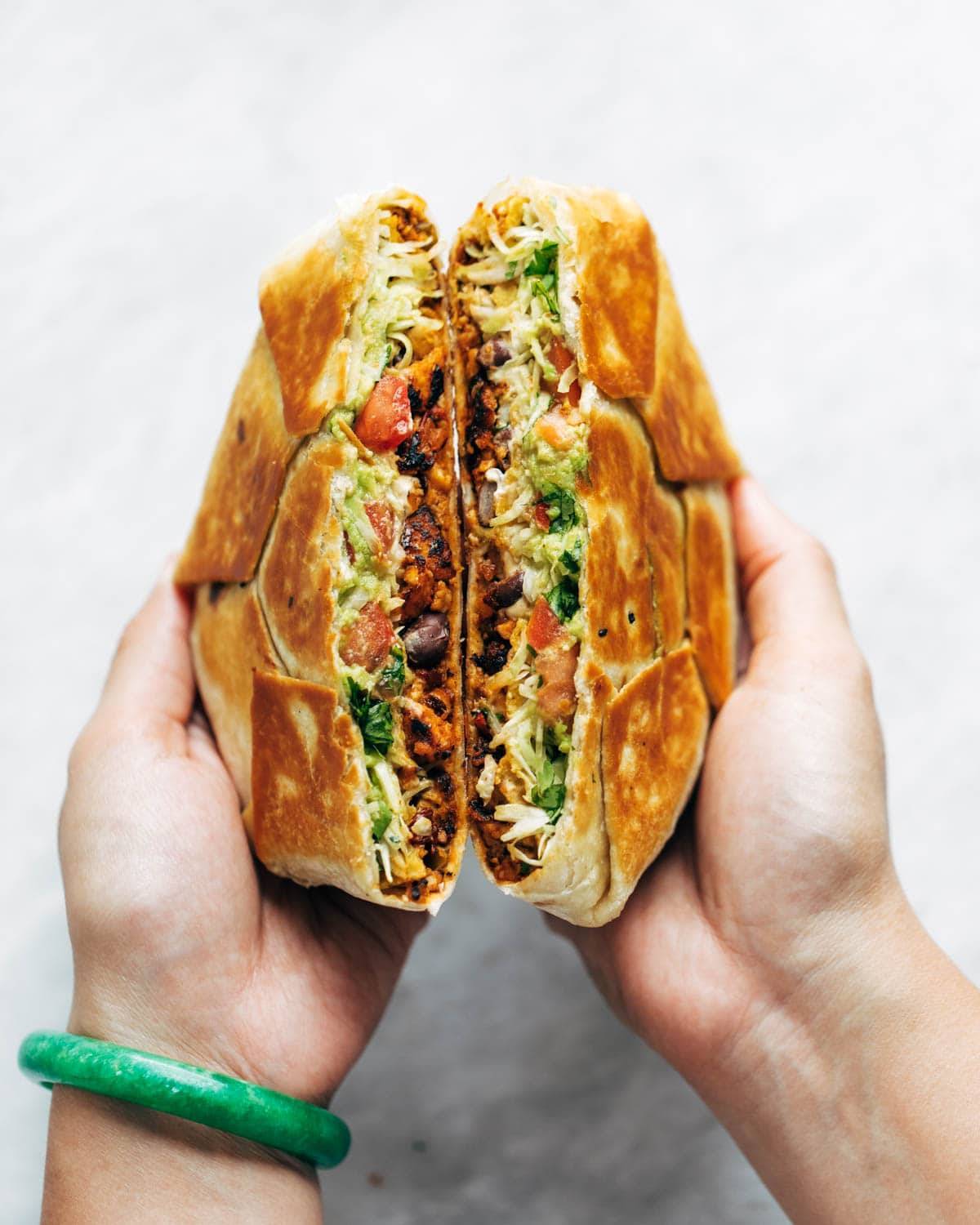 Vegan crunchwrap supreme cut in half.