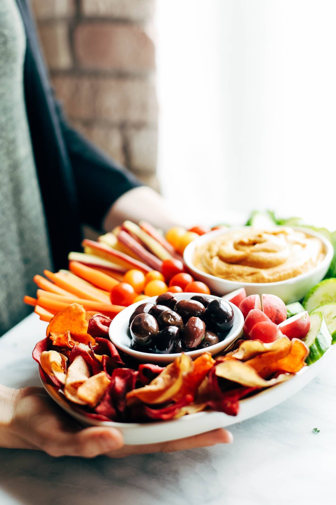 Curry Hummus on a dish with vegetables.