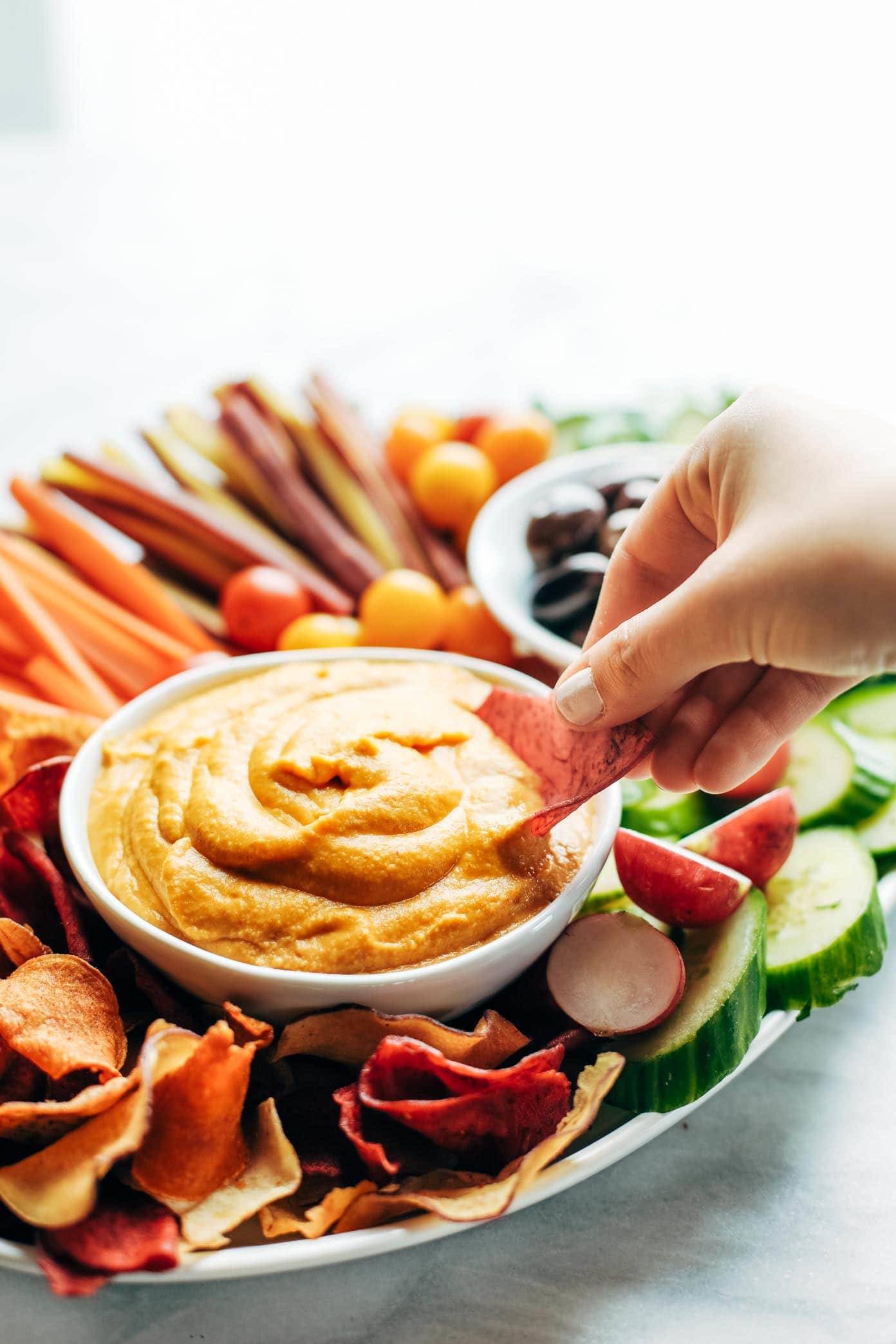 Curry Hummus on a plate with vegetables.