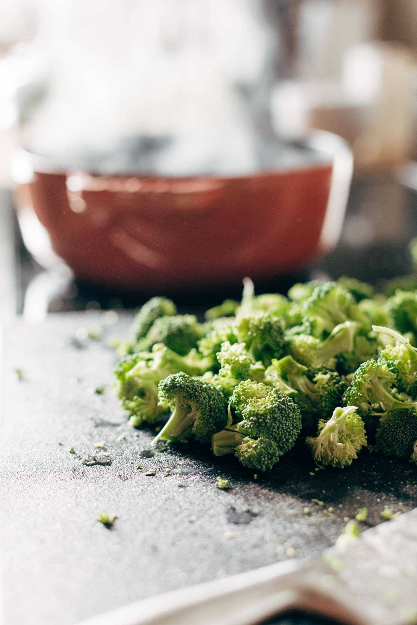 Cut broccoli for vegan broccoli cheese soup.