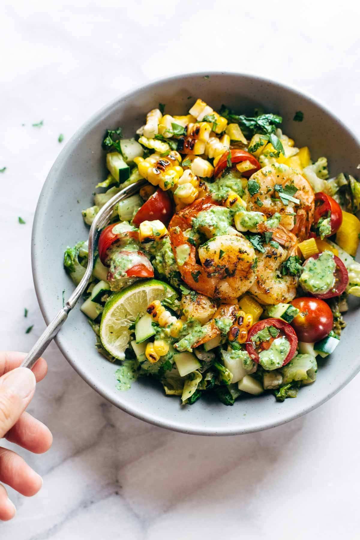 Salad in a bowl with a fork.