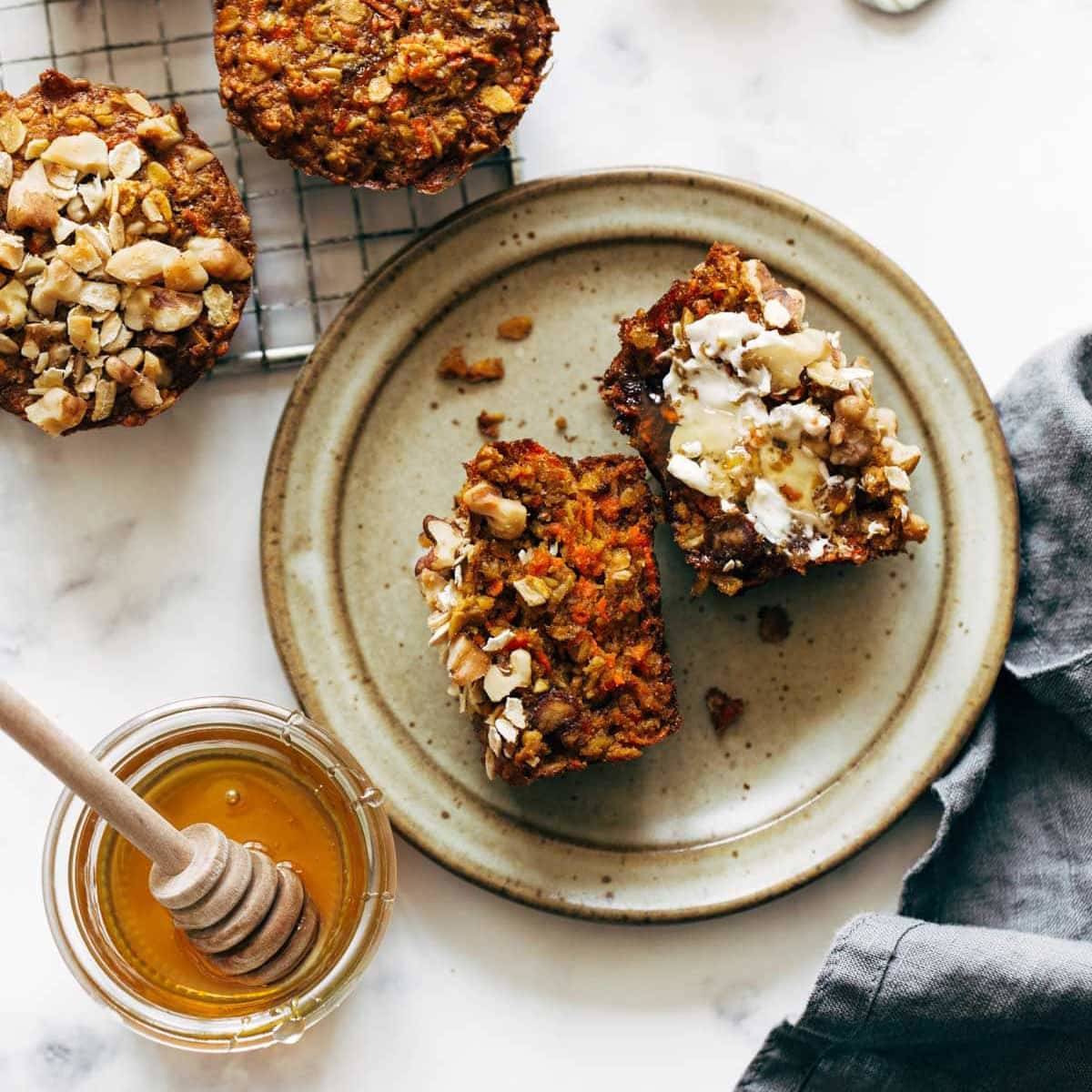 A carrot cake muffin sitting on a plate.