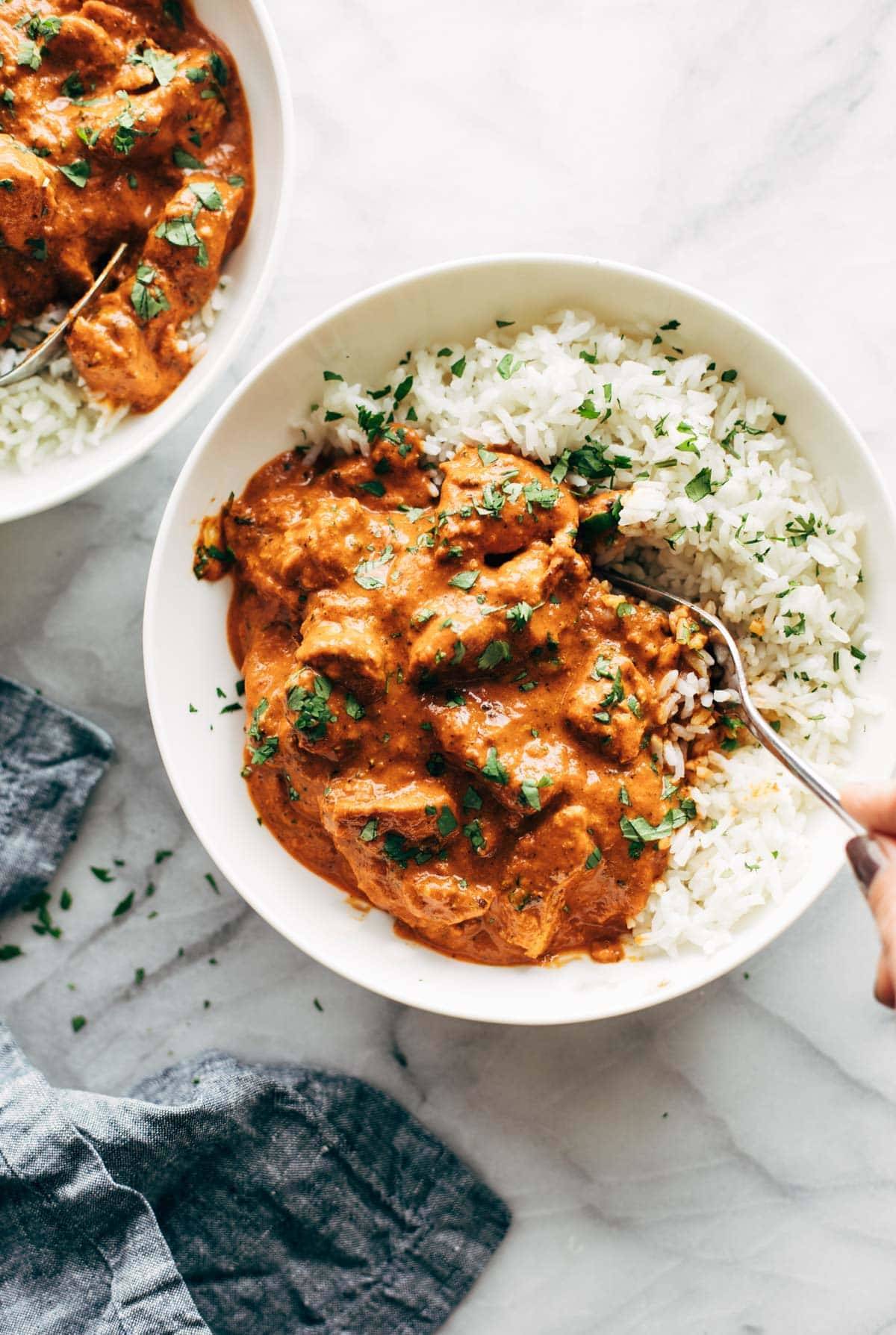 Chicken tikka masala in bowls with rice.