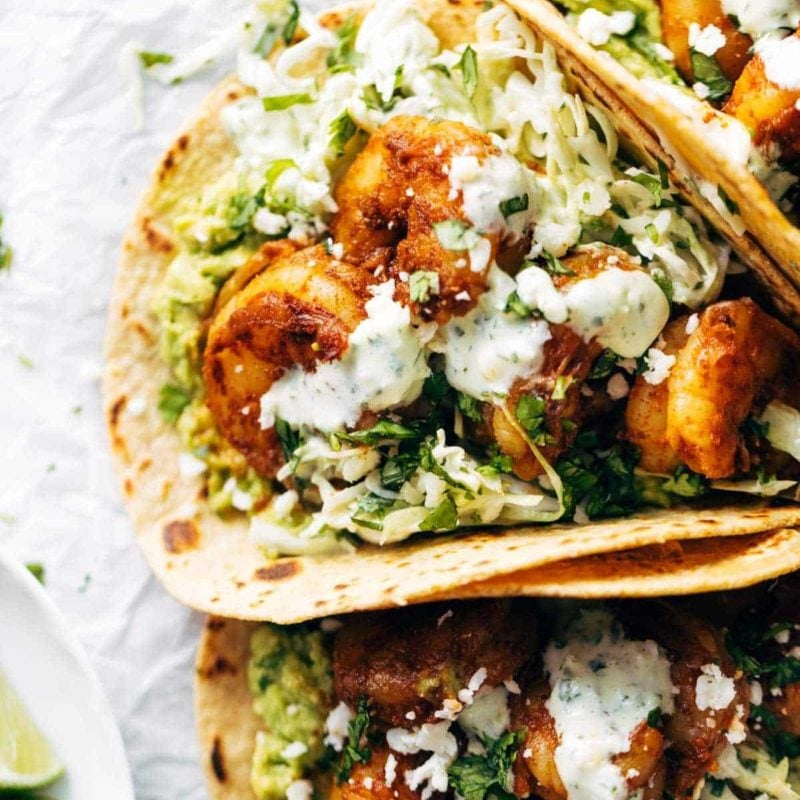 Shrimp tacos with sauce.