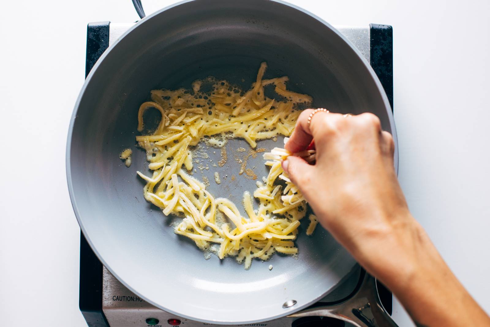 Cheese skirt for a fried egg.