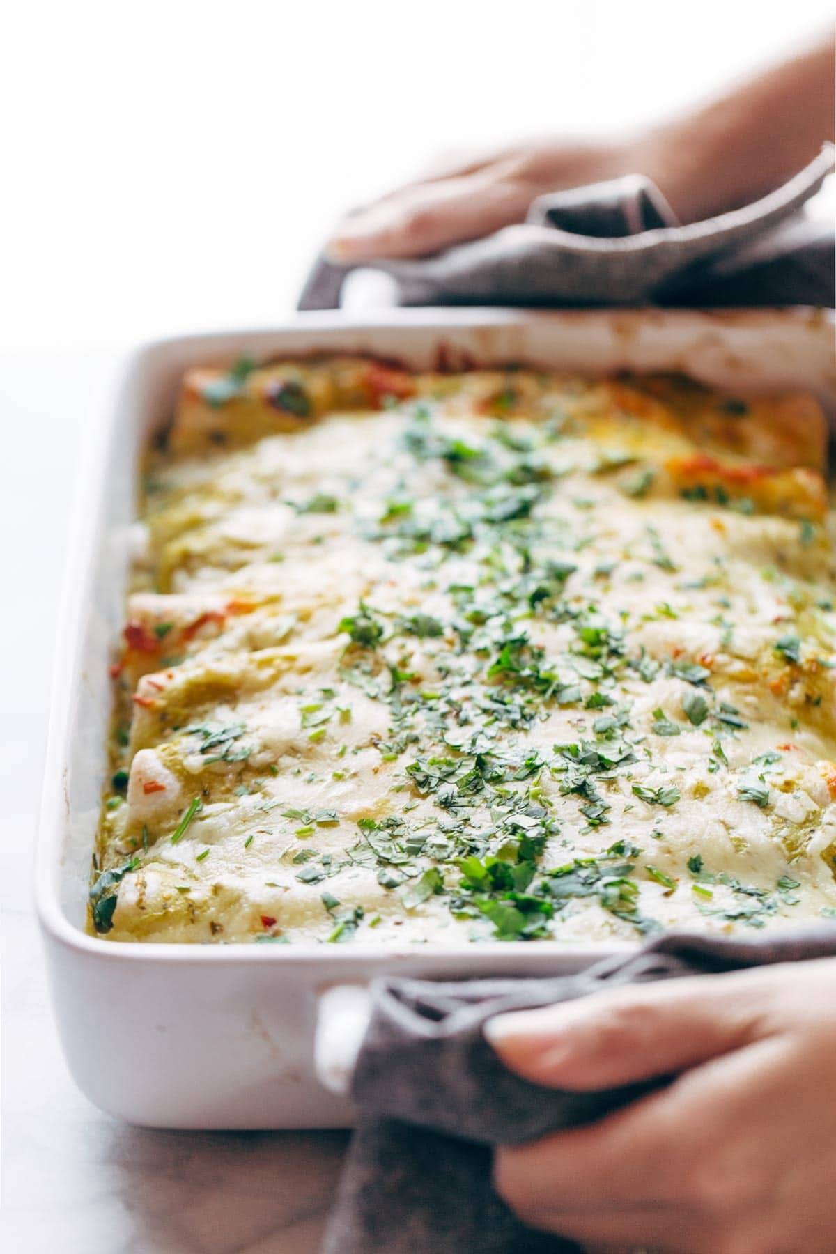 Enchiladas Verdes, with a simple homemade roasted tomatillo sauce that will make your tastebuds rock out. Plus chicken and cheese and tortillas. Super yum. | pinchofyum.com