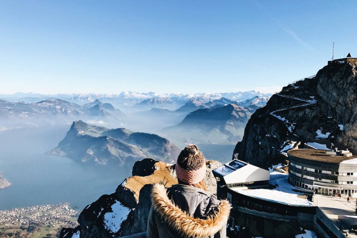 Woman looking out at mountains.