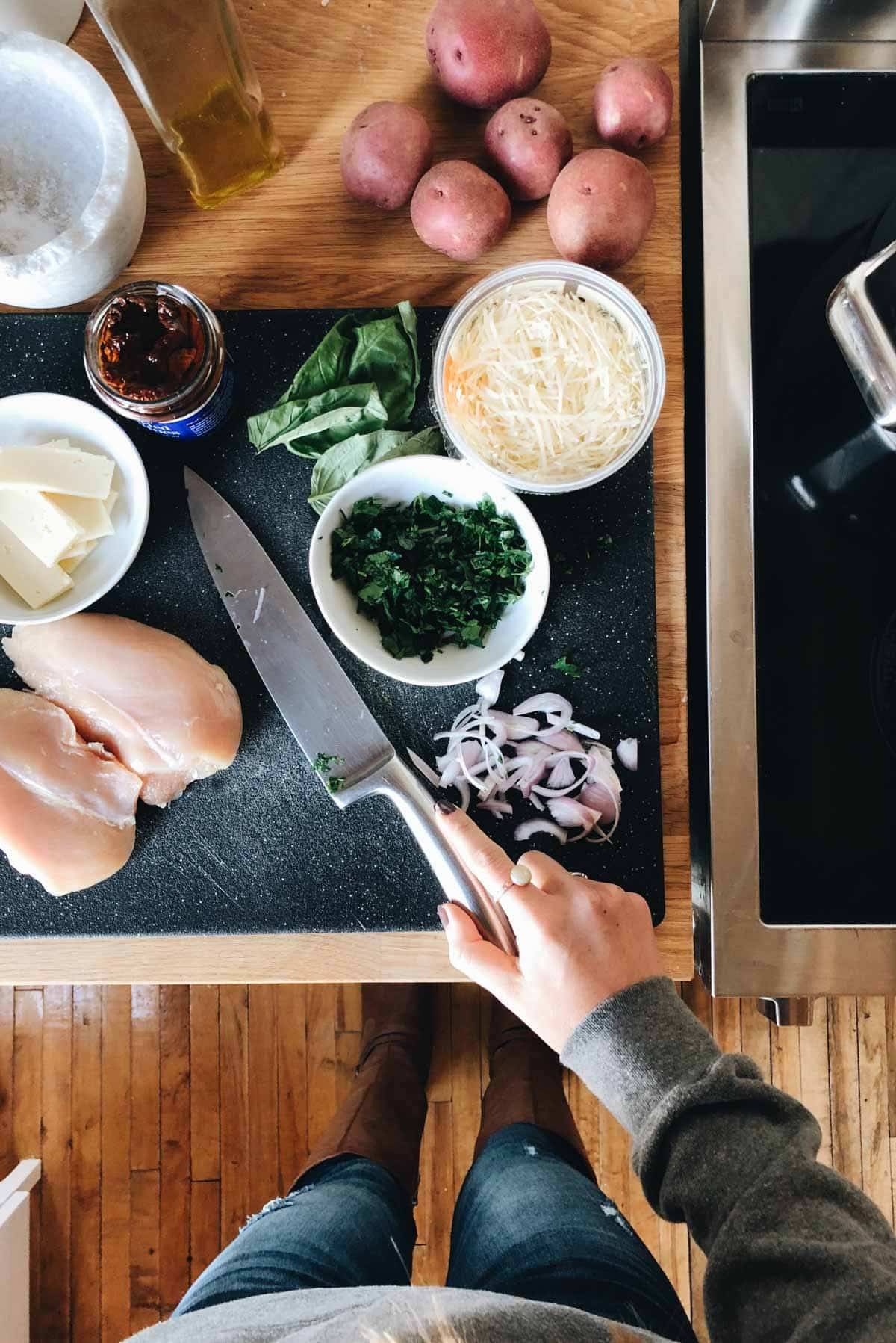 Ingredients on a cutting board with a knife.