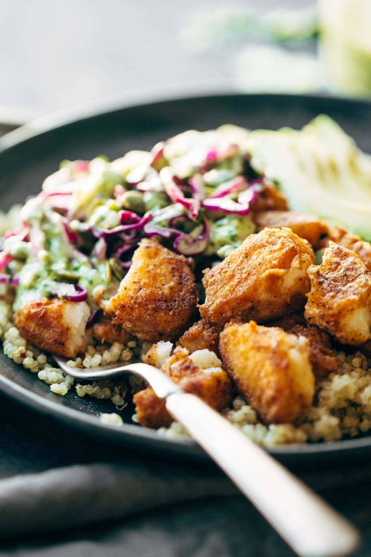 fish taco bowl on a plate with a fork