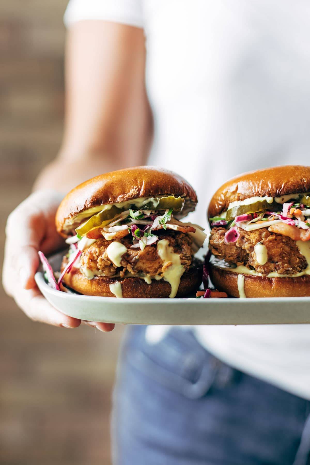 Fried chicken sandwiches on a plate.