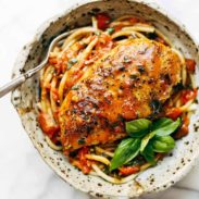 Garlic Basil Chicken in a bowl with spaghetti.