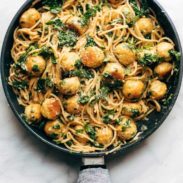 Garlic herb spaghetti and meatballs in a pan.