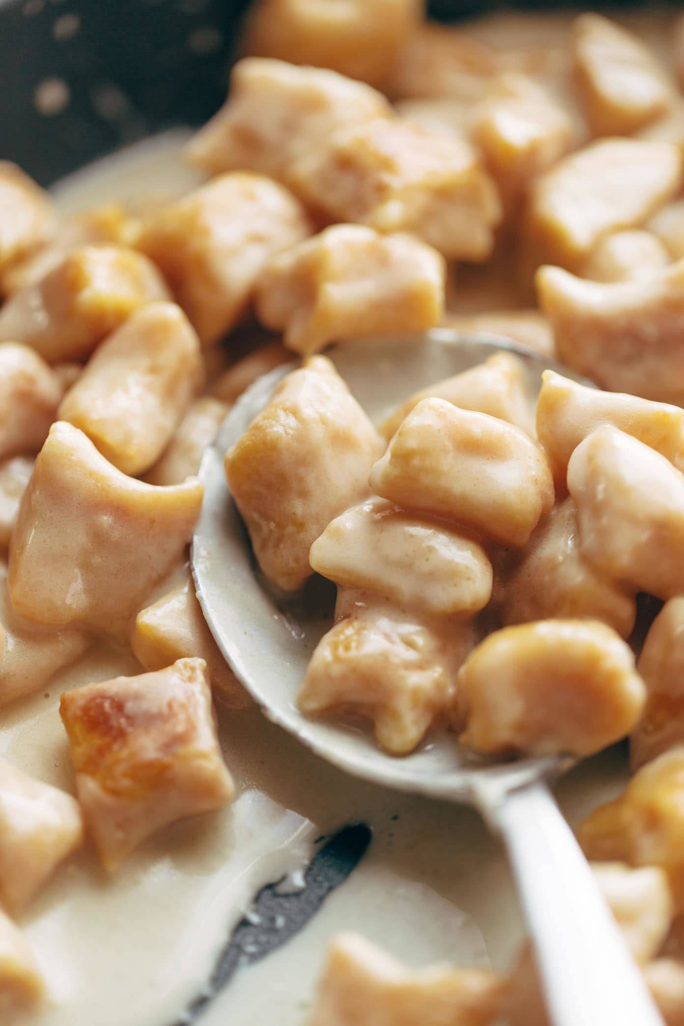 Pumpkin Gnocchi! So incredibly pillowy and delicious. Topped with a 5 ingredient sage garlic butter sauce that will blow your mind. | pinchofyum.com