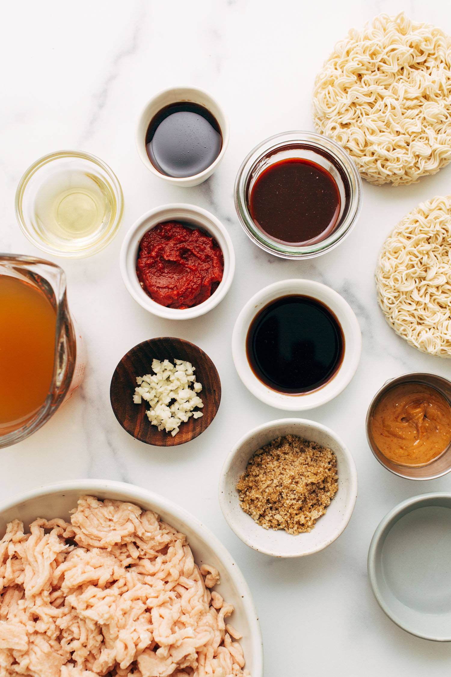 Ingredients in bowls for spicy gochujang noodles.