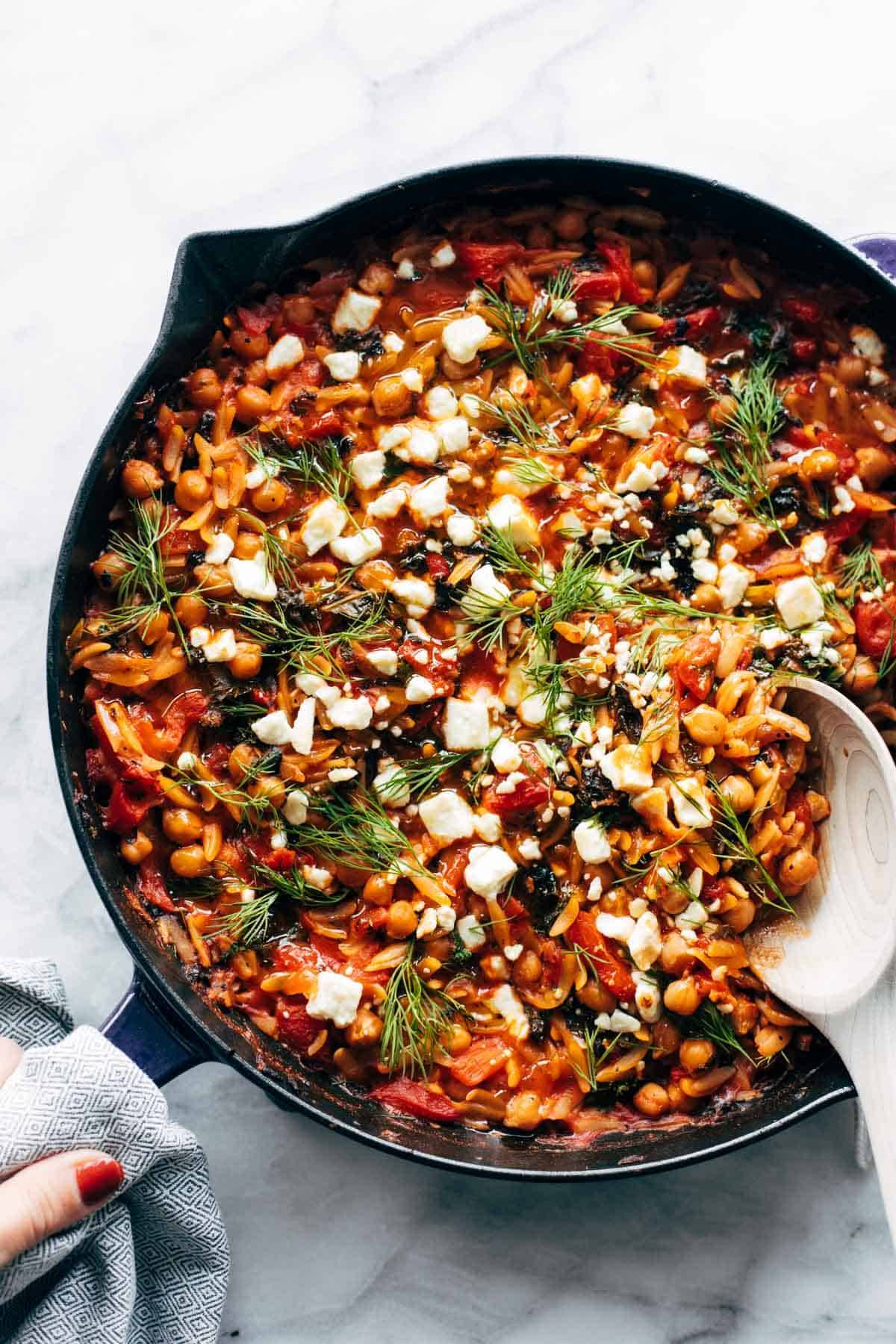 Greek Baked Orzo in a cast iron skillet.