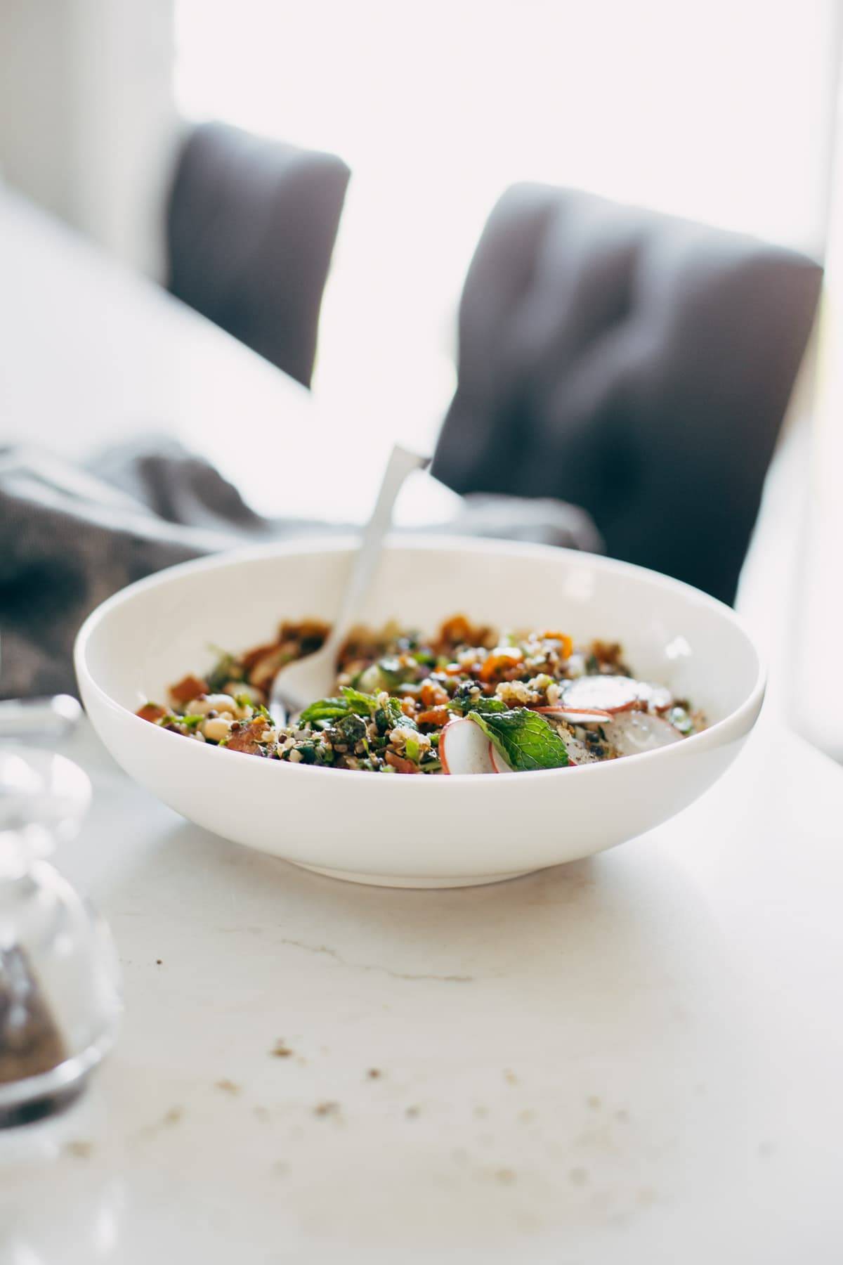 Greek salad in a bowl on a counter.