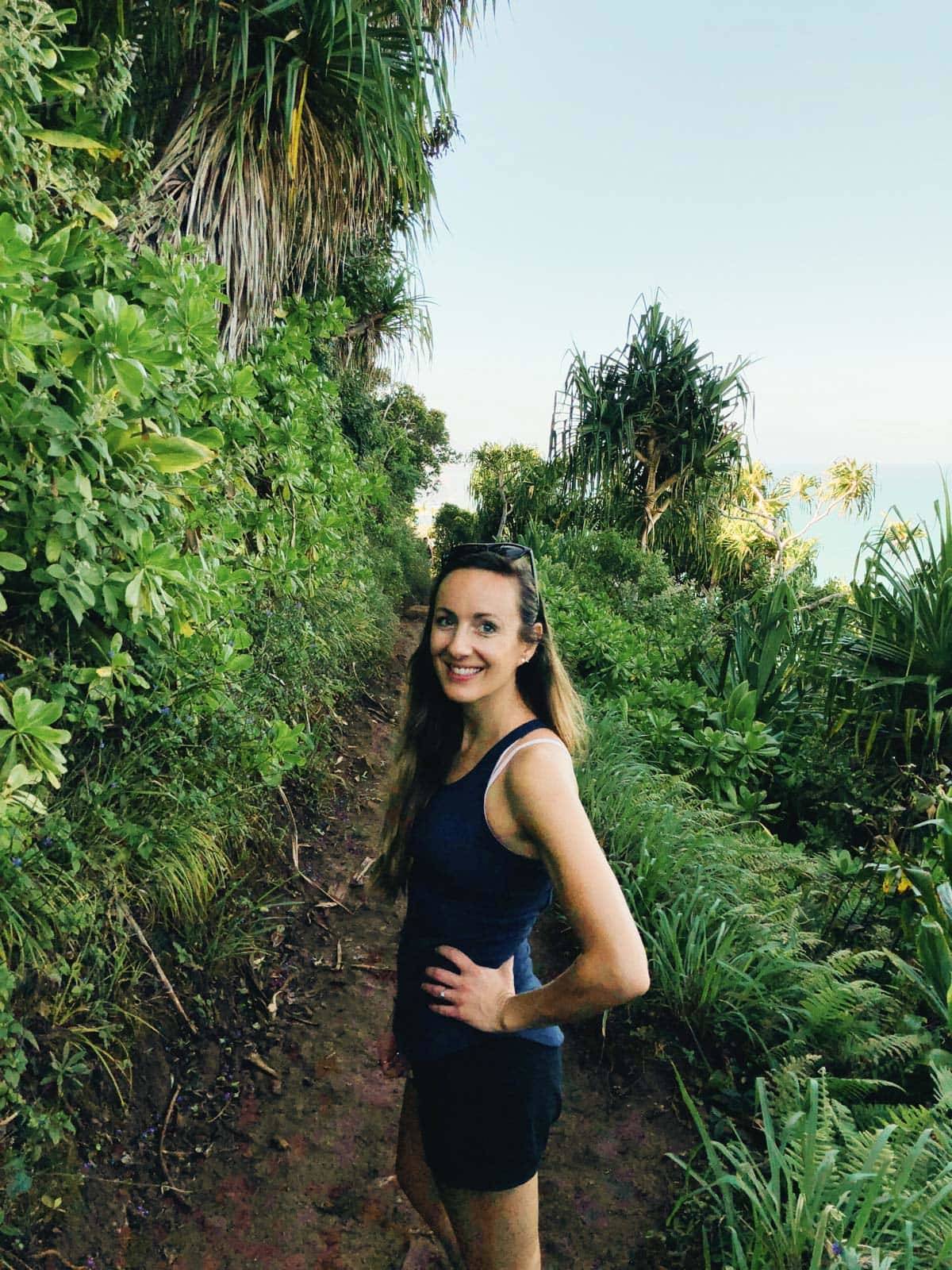 Woman standing on a trail.