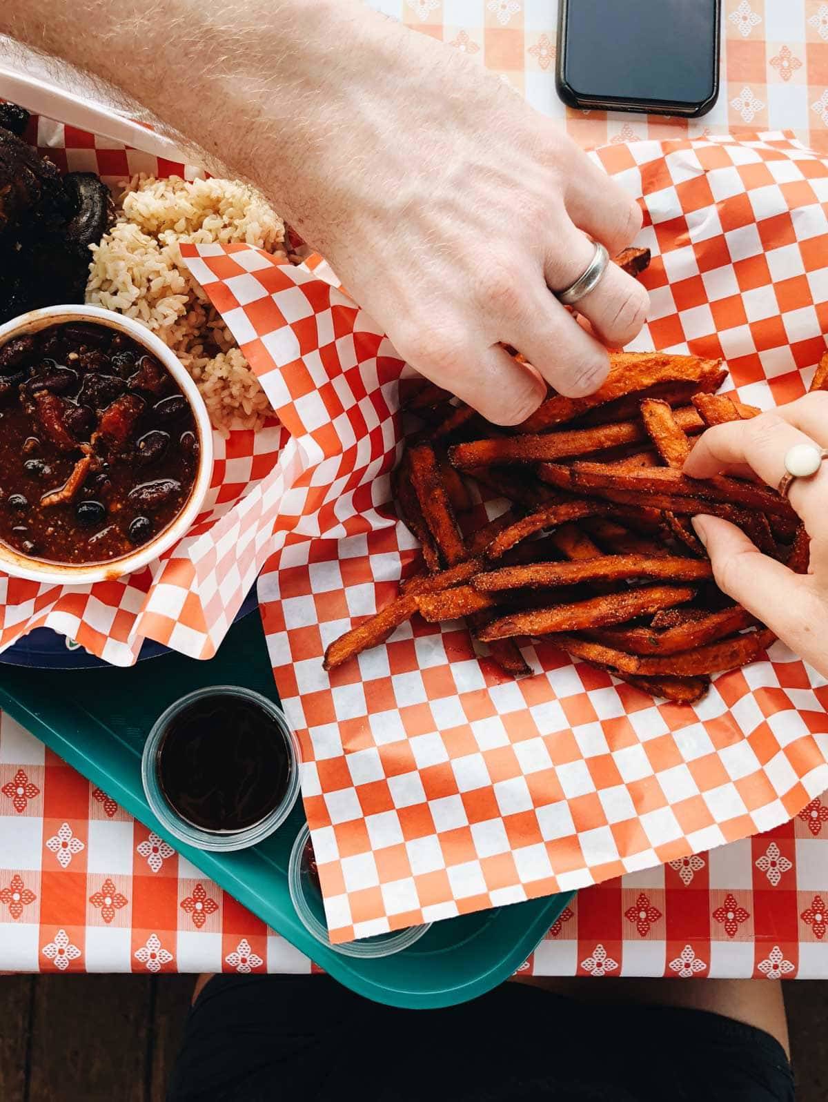 French fries on red and white paper.