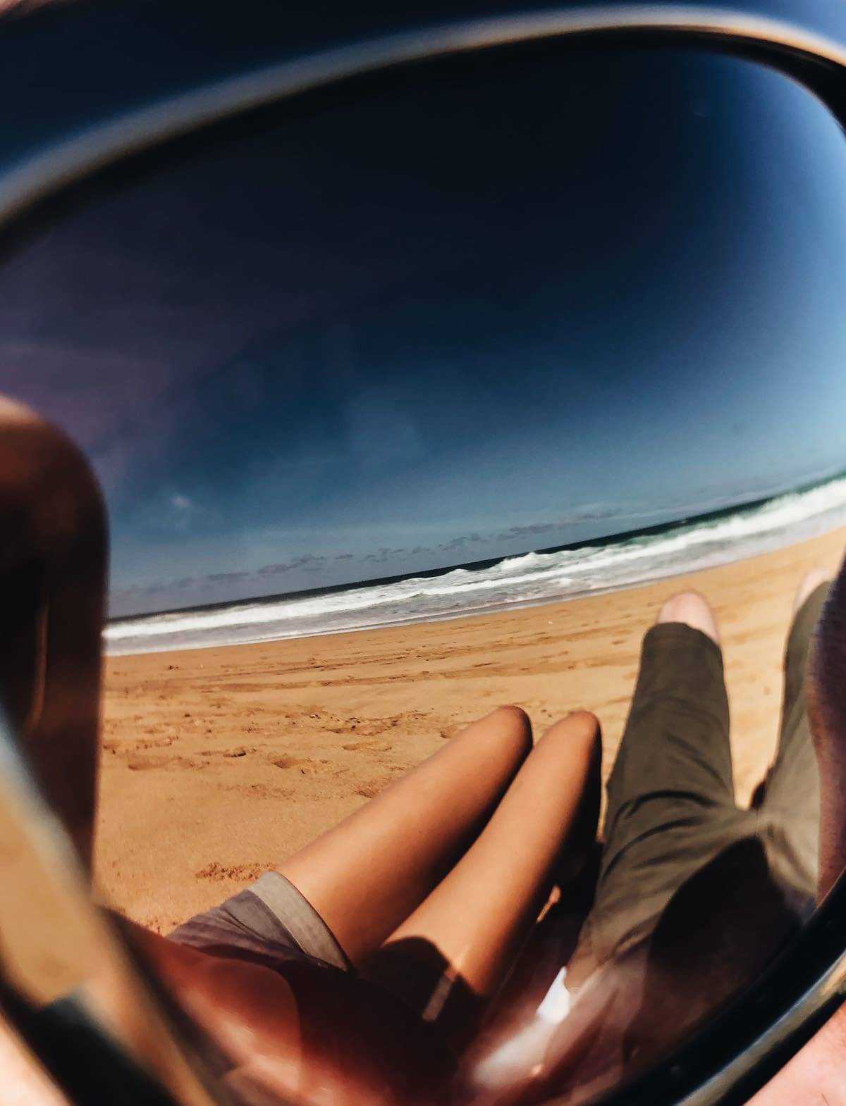 People laying on the beach.