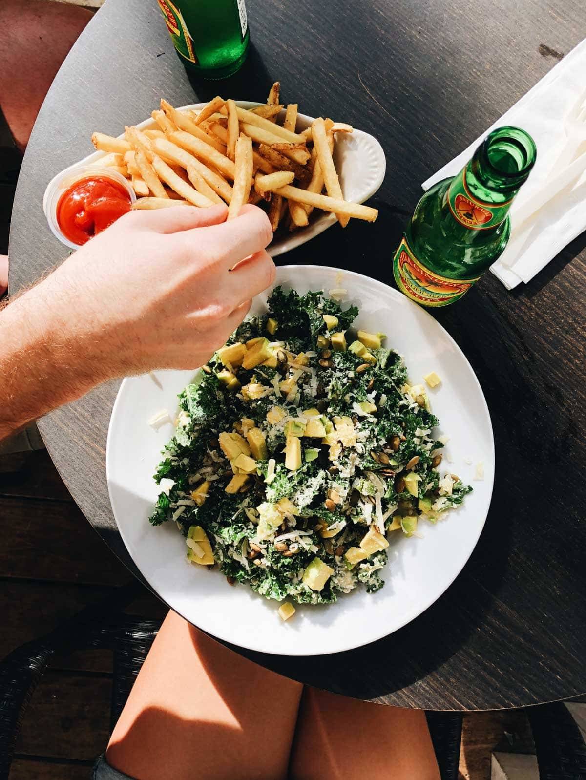 Plate of food and french fries.