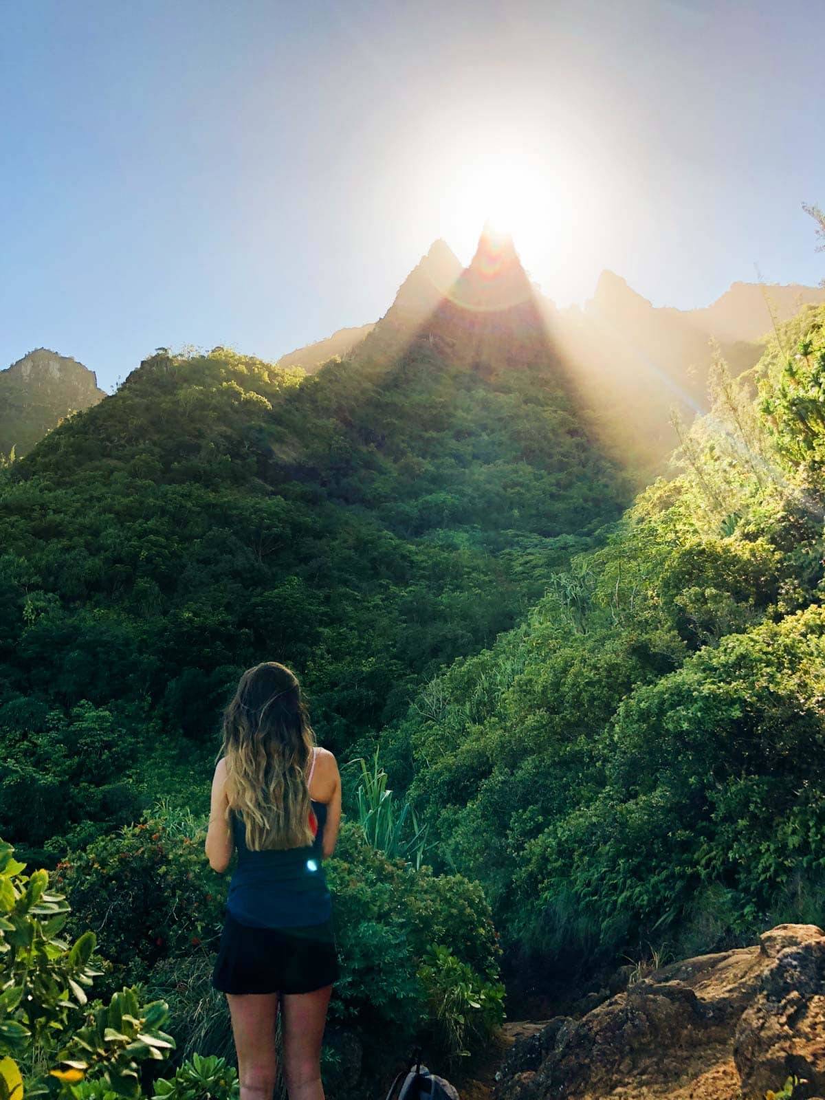 Woman standing in the mountains.