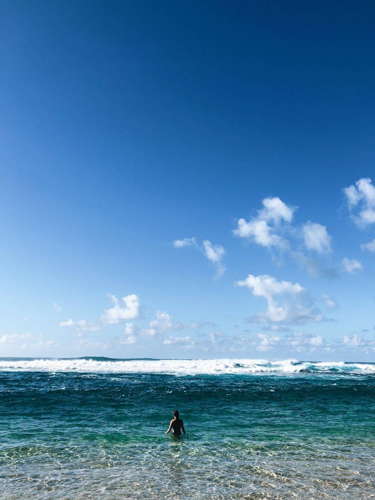 Woman in the ocean.