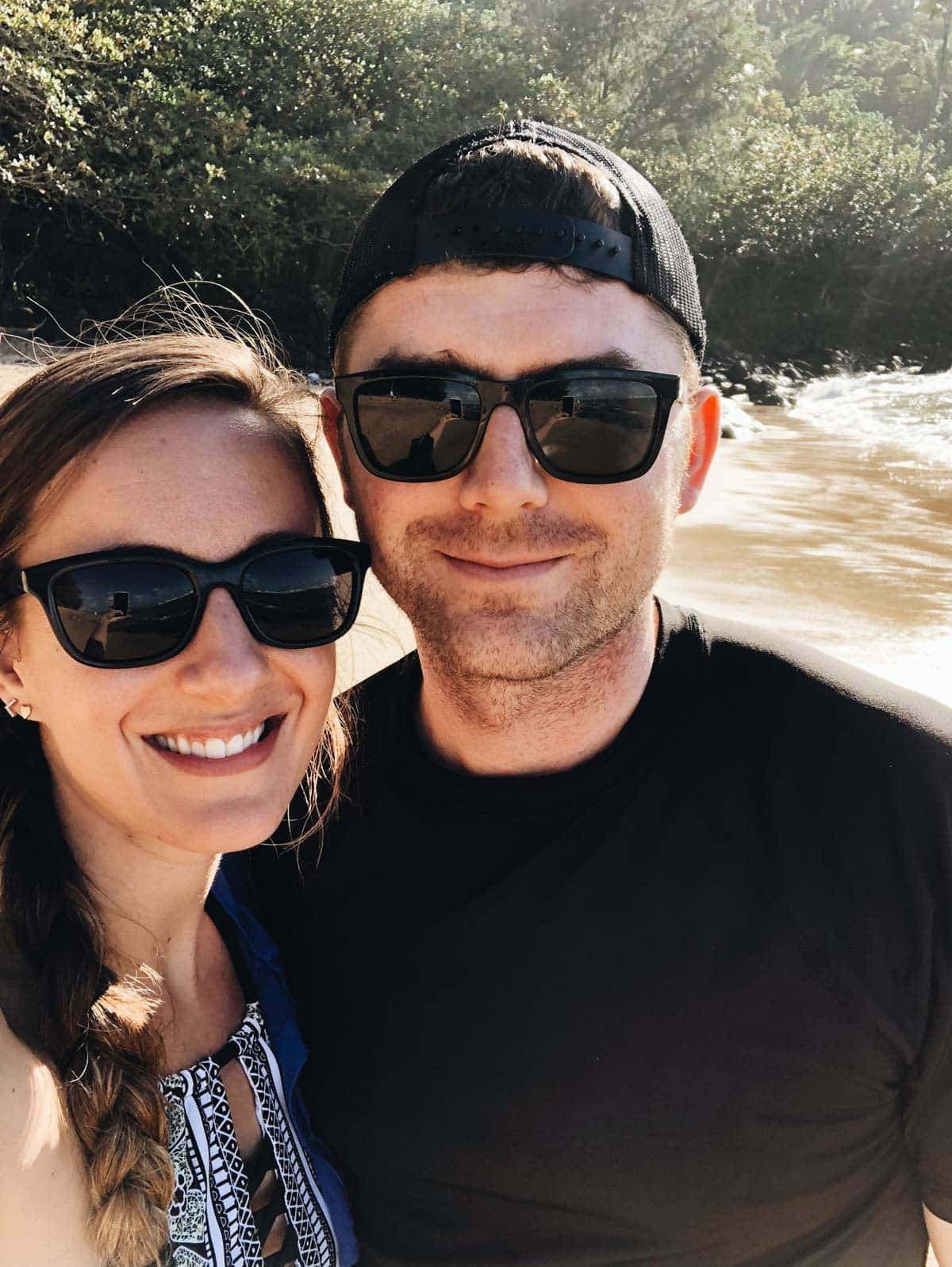 Man and woman wearing sunglasses.