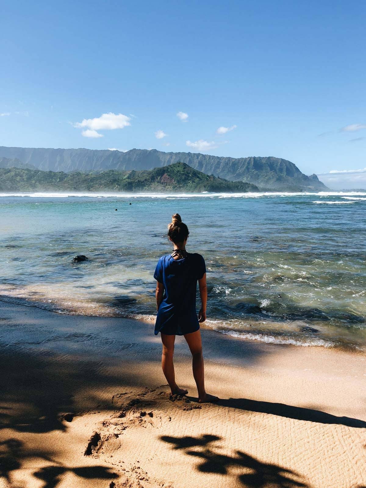 Woman standing on the beach.