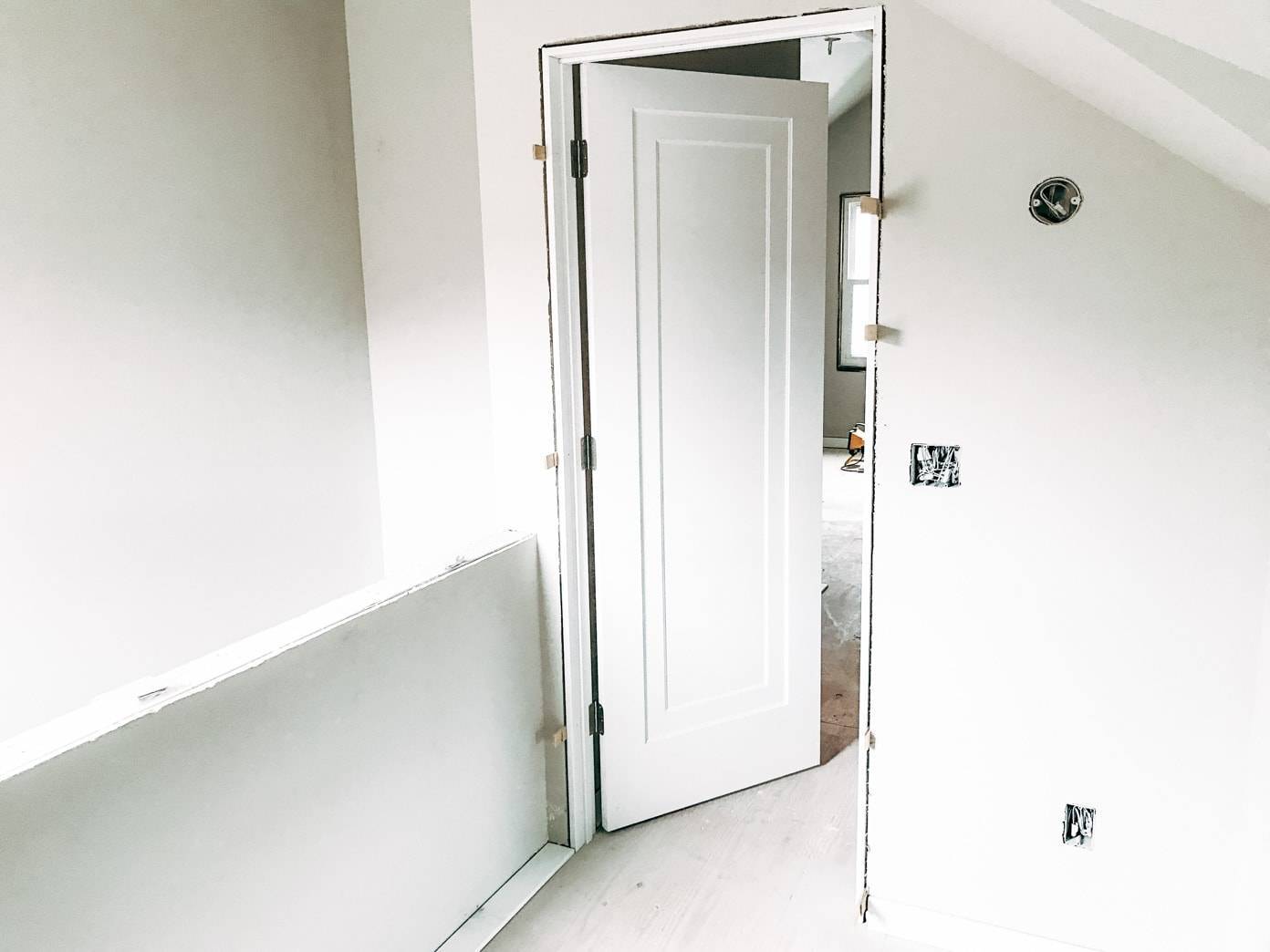 Open doorway to a remodeled attic room.