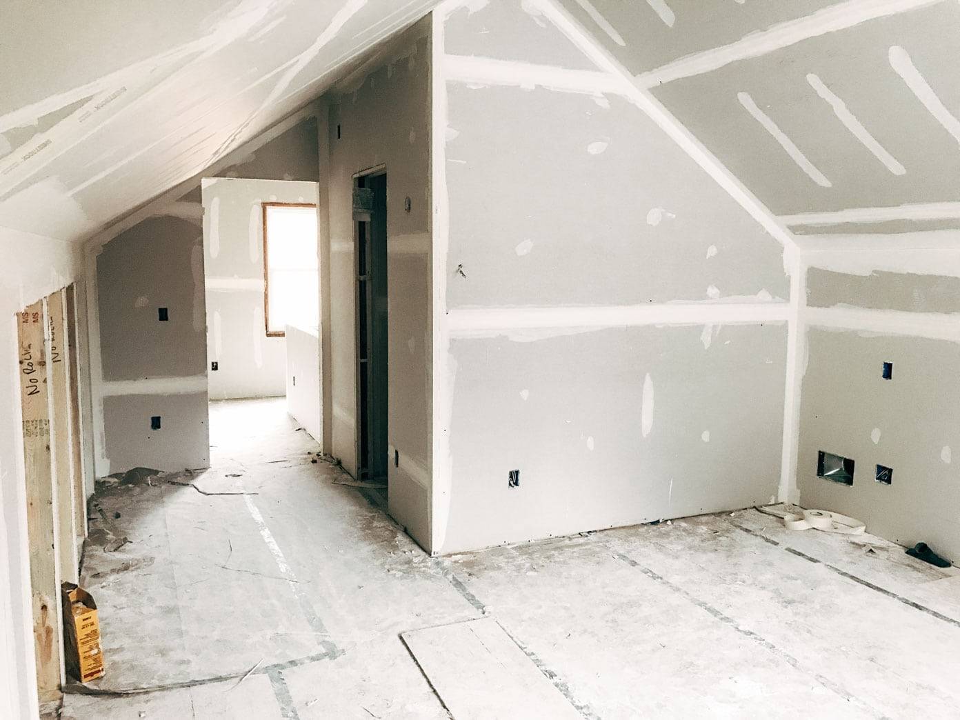 An empty house area has paint lines over its walls.