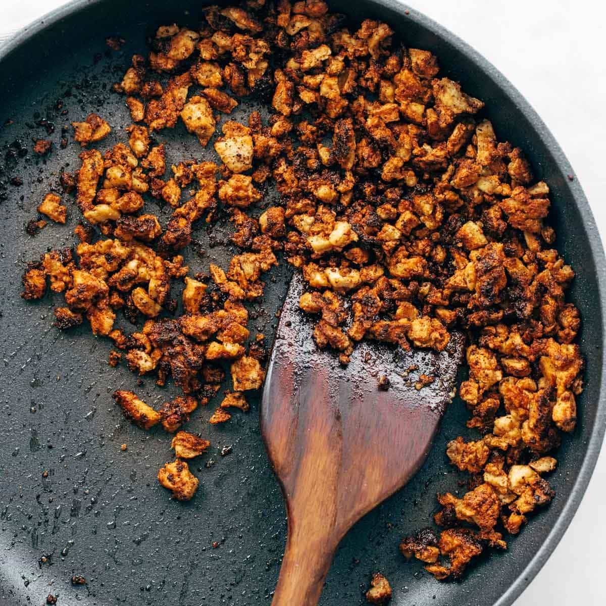 Scrambled tofu in a pan.