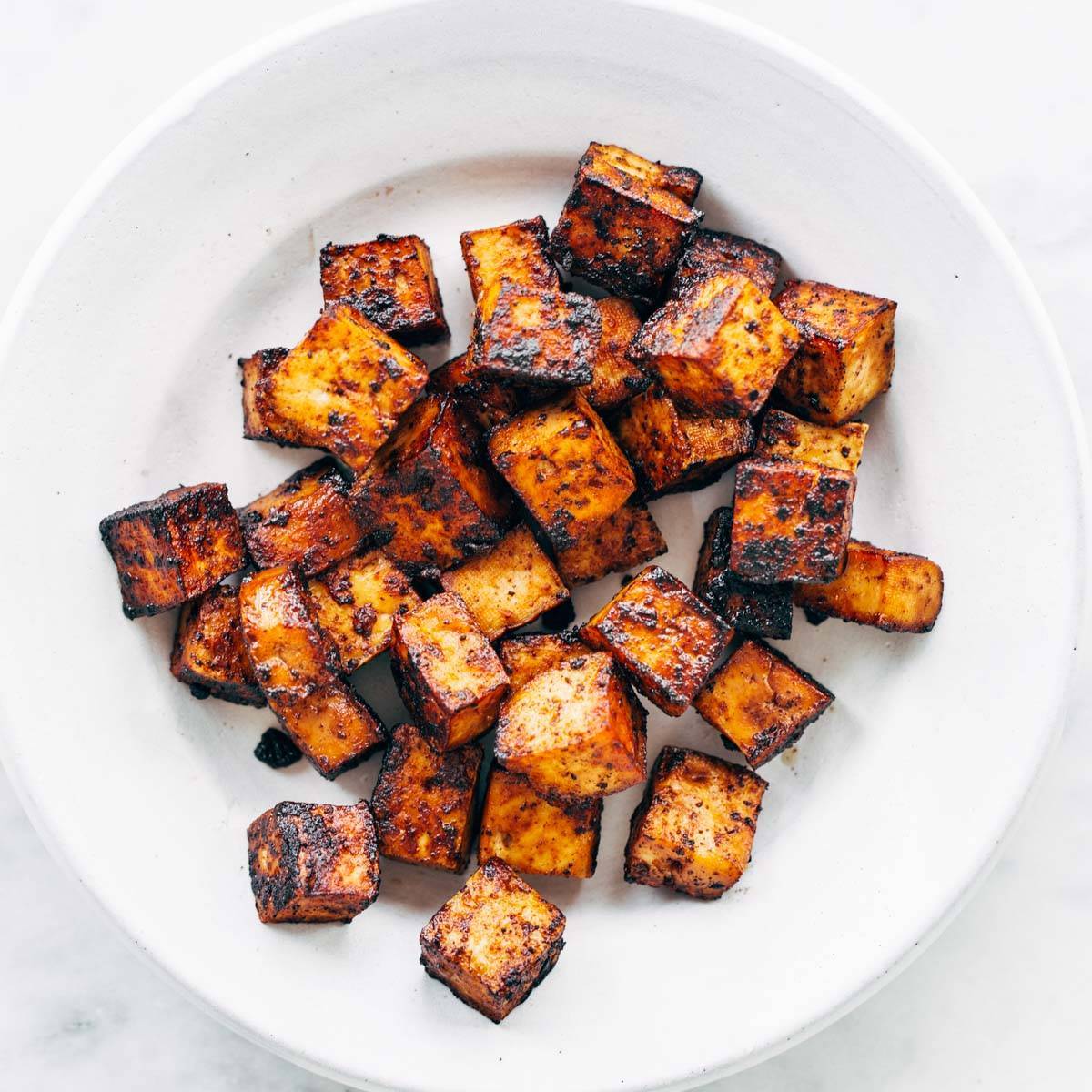 Sautèed tofu on a plate.