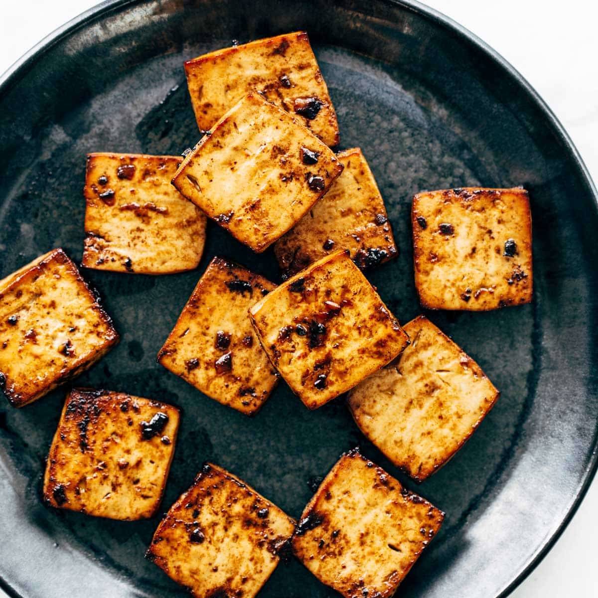 Baked tofu on a plate.