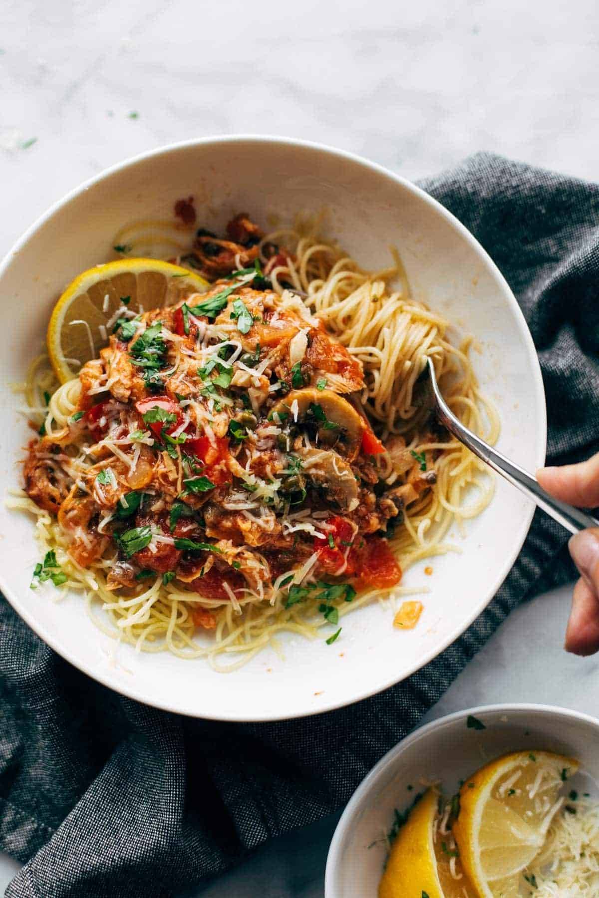 Instant Pot Chicken Cacciatore in a bowl with pasta.