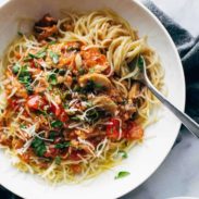 Noodles with a sauce and veggies.