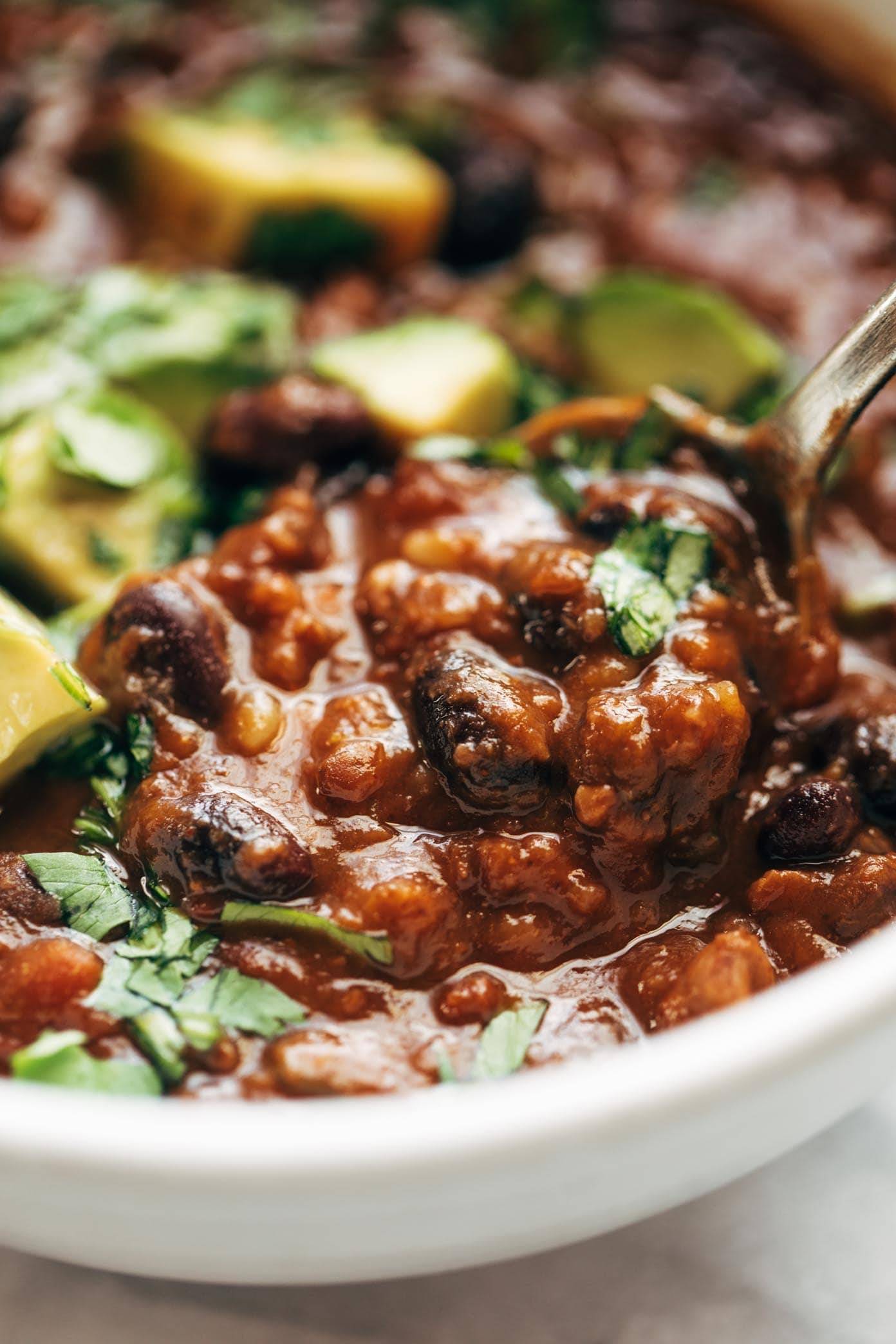 Vegan instant pot chili on a spoon.