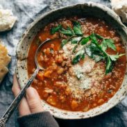 Instant Pot Minestrone Soup in bowl with spoon and bread.