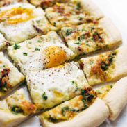 A picture of Breakfast Pizza with Kale Pesto and Sun Dried Tomatoes