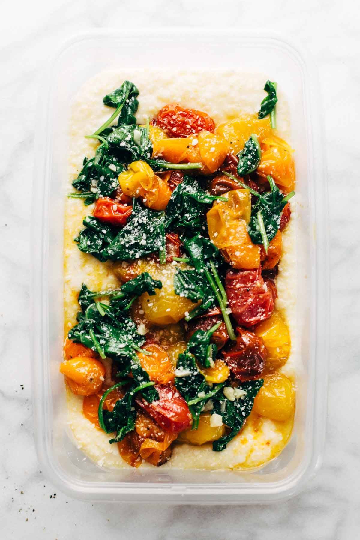 Roasted Tomatoes with Goat Cheese Polenta! Fresh, juicy tomatoes, vibrant green spinach, and a creamy goat cheese polenta! | pinchofyum.com