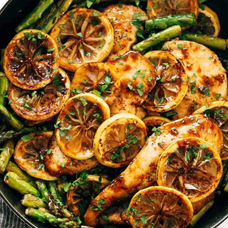 Lemon chicken with asparagus in a pan