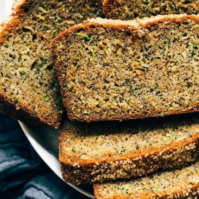 Slices of lemon zucchini bread in a bowl.