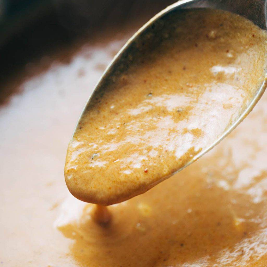 Masala sauce on a spoon.