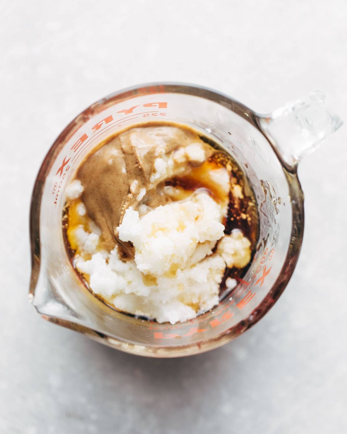 Magic Vegan Caramel Sauce in a measuring cup.