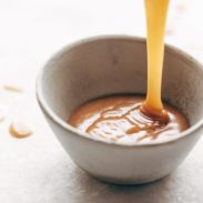 Vegan Caramel Sauce poured into a bowl.