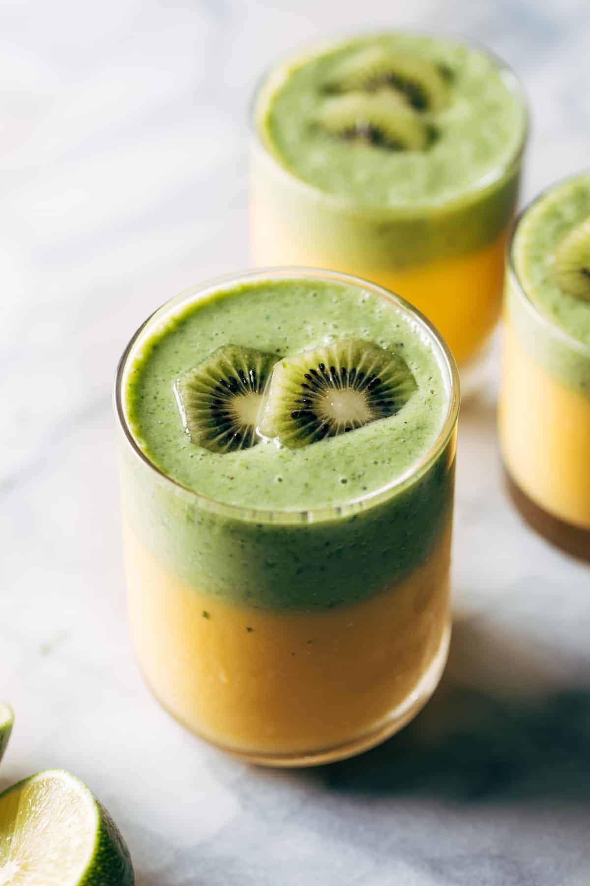 Kiwi mango coolers in glasses.