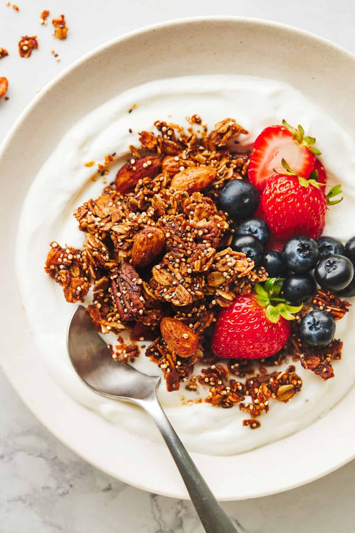 Granola on a bed of yogurt.