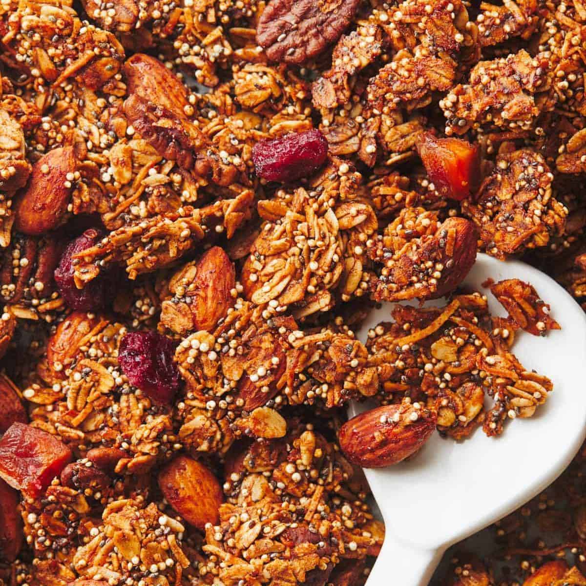 Maple quinoa granola with a spoon.